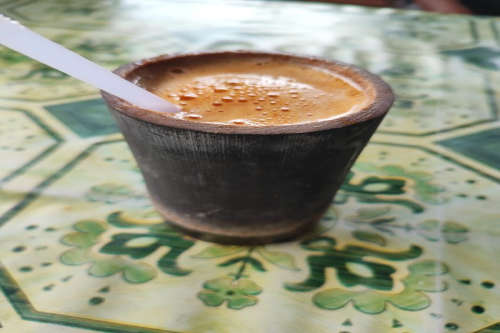 photo of niro talua with bamboo glass